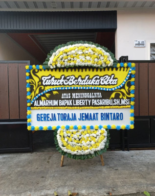 Papan Bunga Duka di Simpar